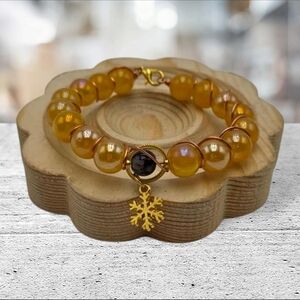 Handmade wirewrapped Gold Beaded Bracelet with Snowflake Charm